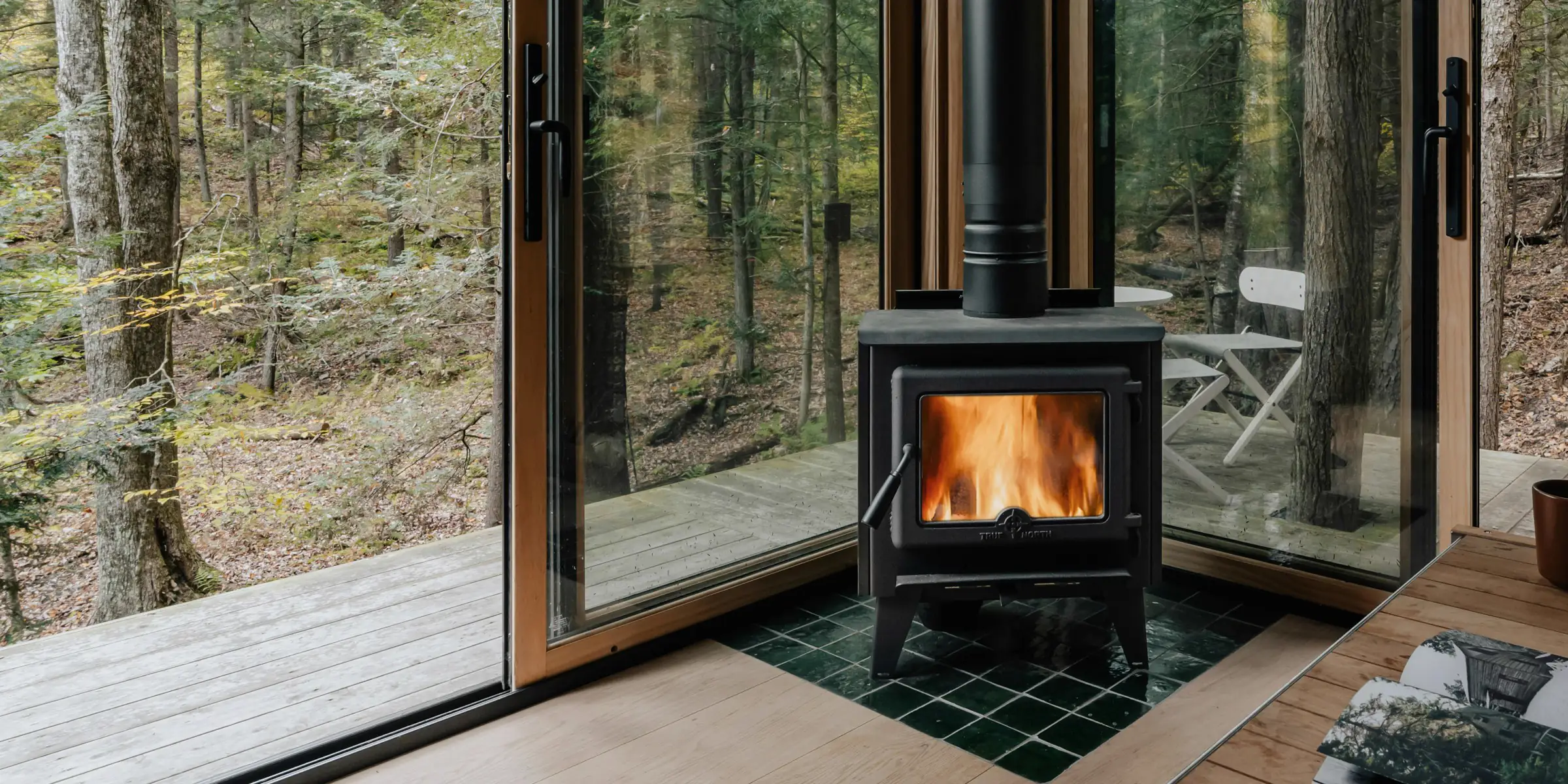A wood-burning stove overlooking a peaceful forest